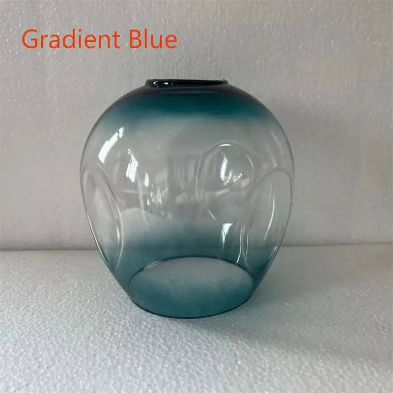 Gradient blue glass vase with smooth rounded body and embossed circular patterns for modern nordic glass chandeliers