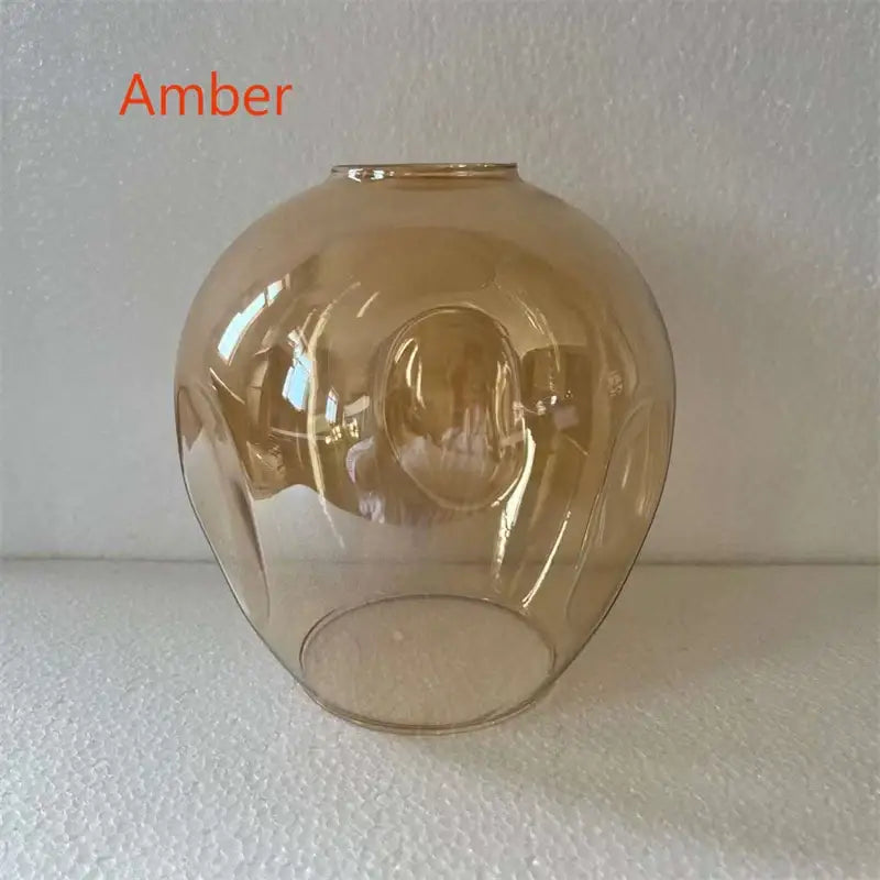 Amber-colored glass chandeliers pendant lamps with smooth rounded dome shape and subtle internal ridges modern nordic glass