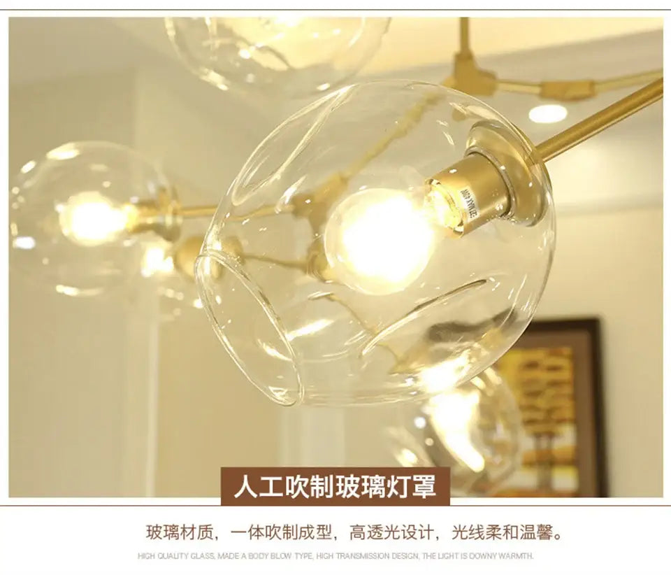 Clear hand-blown glass chandeliers with warm golden brass fixture in modern nordic glass pendant lamps design