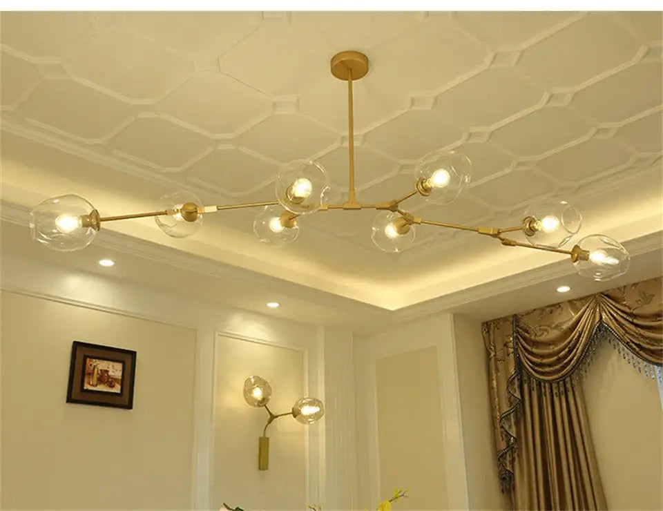 Gold-toned decorbites™ modern nordic glass chandelier with clear glass globe bulbs and sleek branching design for ceiling lighting