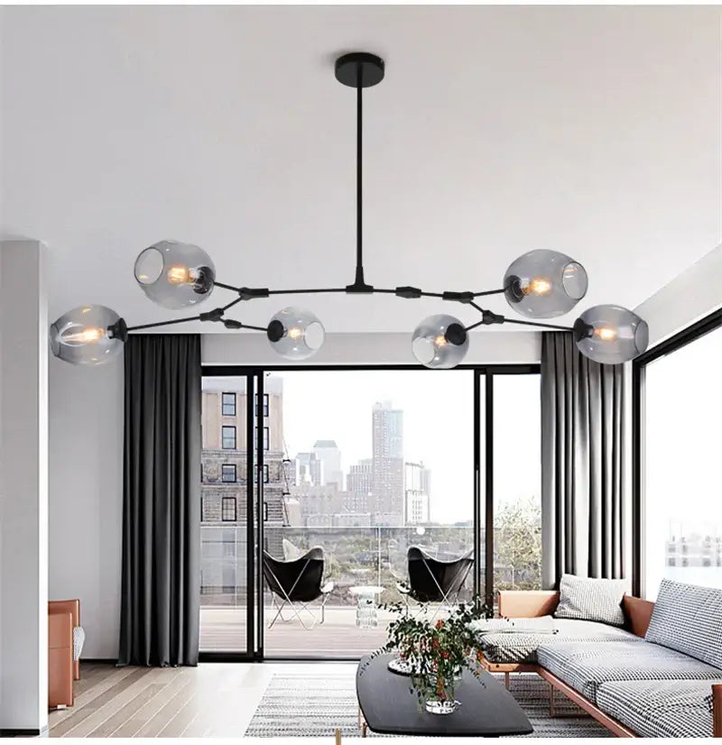 Modern nordic glass chandelier by decorbites featuring black metal and frosted glass globe bulbs with led lighting