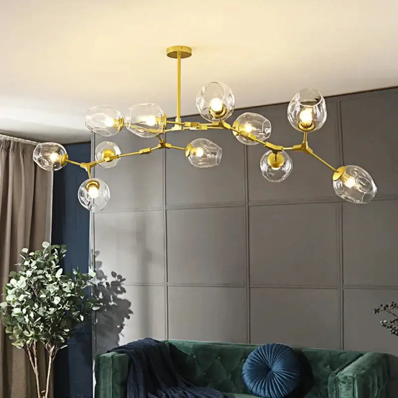 Gold-toned DecorBites™ modern nordic glass chandelier with multiple clear globe shades and integrated LED lighting