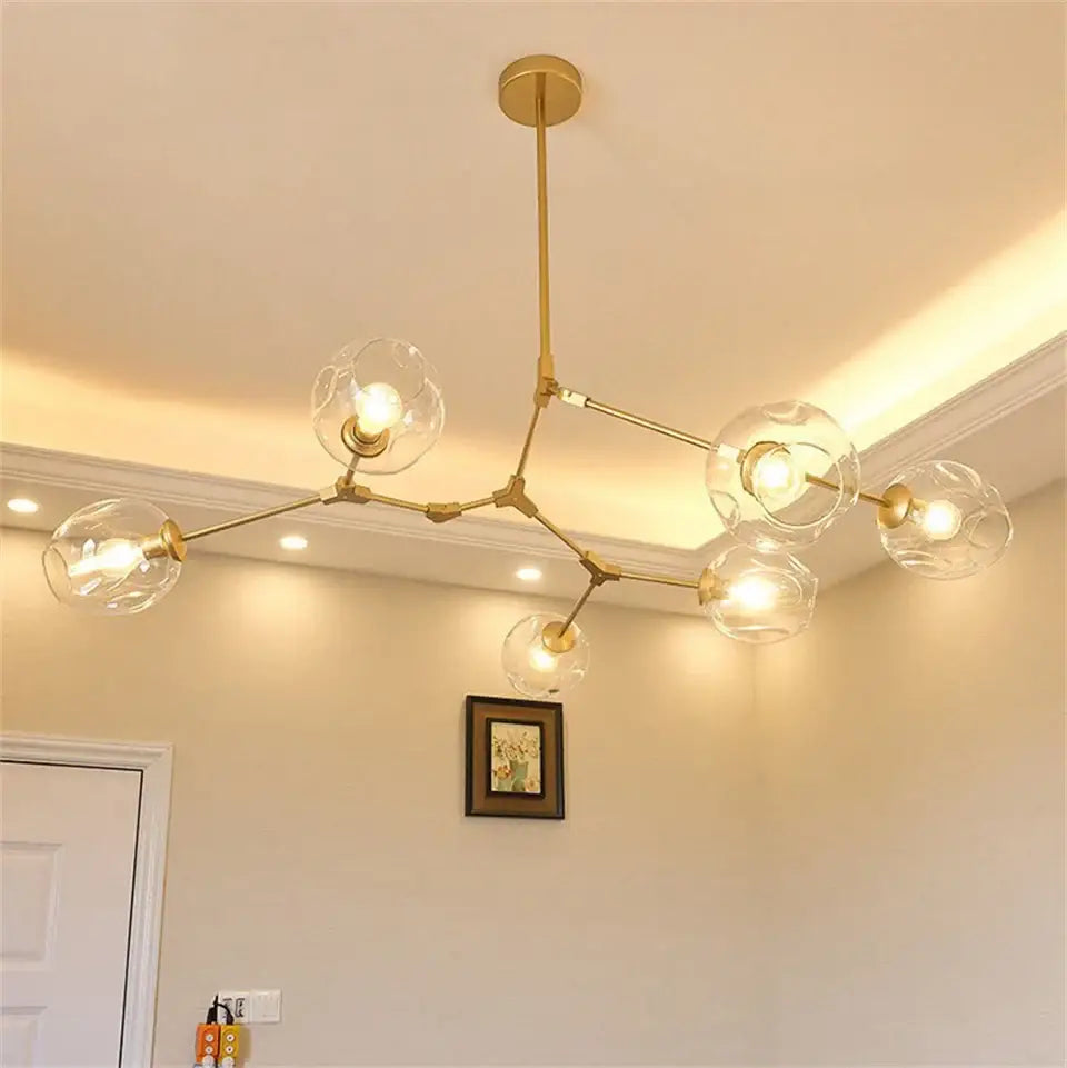 Decorbites modern nordic glass chandelier with gold-toned frame and clear glass globe bulbs nordic lustre design