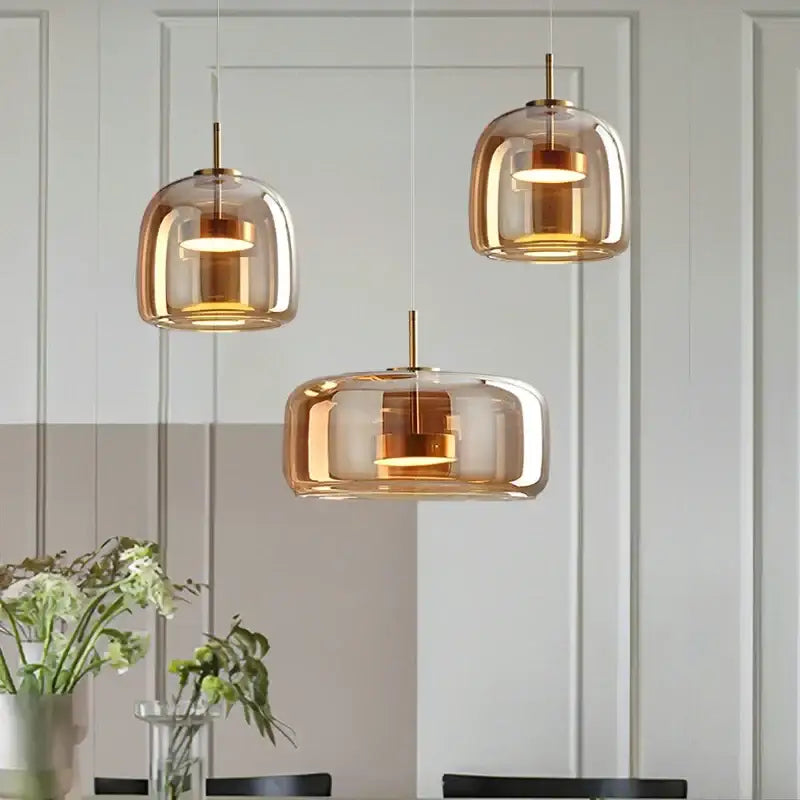 DecorBites™ modern nordic glass pendant lamp with amber-tinted glass and brass accents for contemporary kitchens