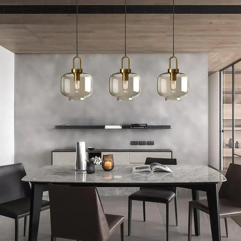 DecorBites modern nordic glass pendant light with brass fixtures and smoked glass shades for kitchen and restaurant use