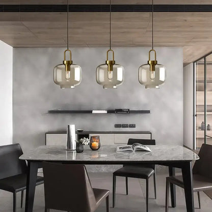 DecorBites modern nordic glass pendant light with brass fixtures and smoked glass shades for kitchen and restaurant use
