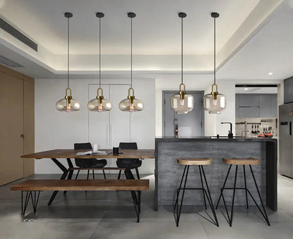 Five brass-finished decorbites™ modern nordic glass pendant lights with frosted shades for kitchen and restaurant use