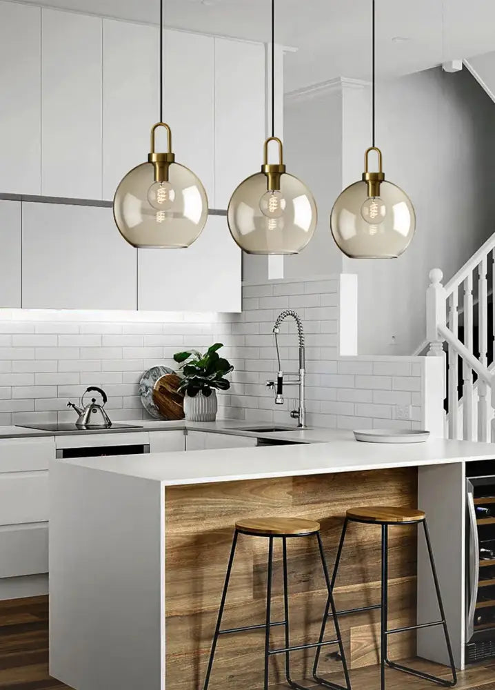 DecorBites modern Nordic glass pendant light with smoked glass globes and brass fixtures for kitchen and restaurant use