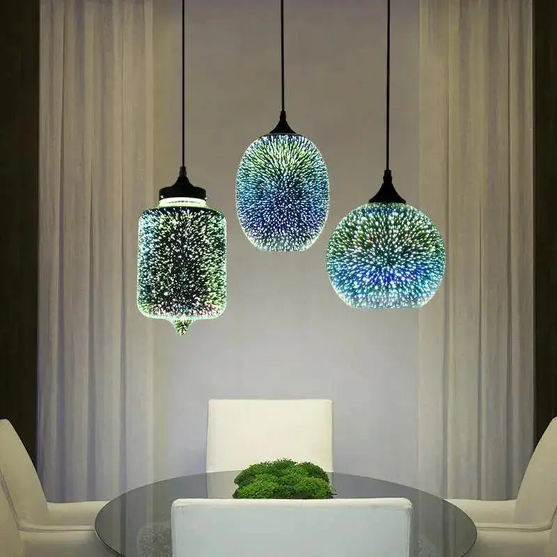 Three modern nordic glass pendant lights with iridescent blue and green starburst-patterned shades by DecorBites™