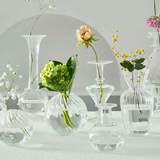 Decorbites™ modern nordic clear glass vases set with ribbed textures holding delicate flowers to decorate root spaces
