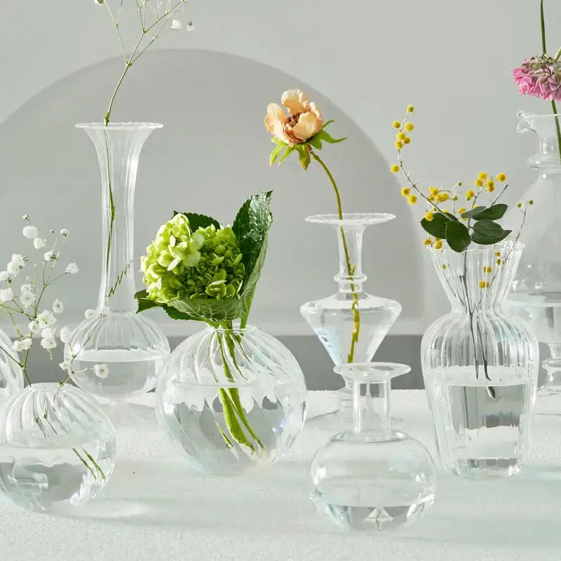 Decorbites™ modern nordic clear glass vases set with ribbed textures holding delicate flowers to decorate root spaces