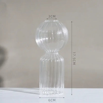 Clear glass DecorBites™ vase with ribbed bulbous upper section and slender base to decorate root for home or wedding