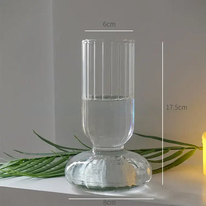 Clear glass DecorBites™ modern nordic vase with vertical ridges and fluted base filled halfway with water, height 750px width 750px