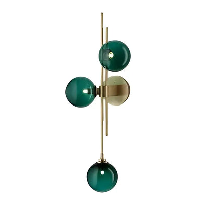 Decorbites modern nordic wall sconce featuring an emerald green glass shade with brass accents by adabella