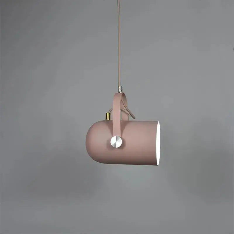 A sleek blush pink cylindrical DecorBites™ modern nordic hanging light with leather strap and metallic accents
