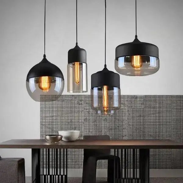 Set of three DecorBites modern nordic pendant lighting with black metal shades and clear glass globes housing filament bulbs