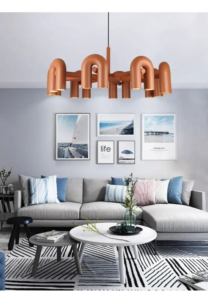 Copper-toned industrial-style DecorBites™ modern Nordic led ceiling chandelier with curved pipe-like arms and central rod