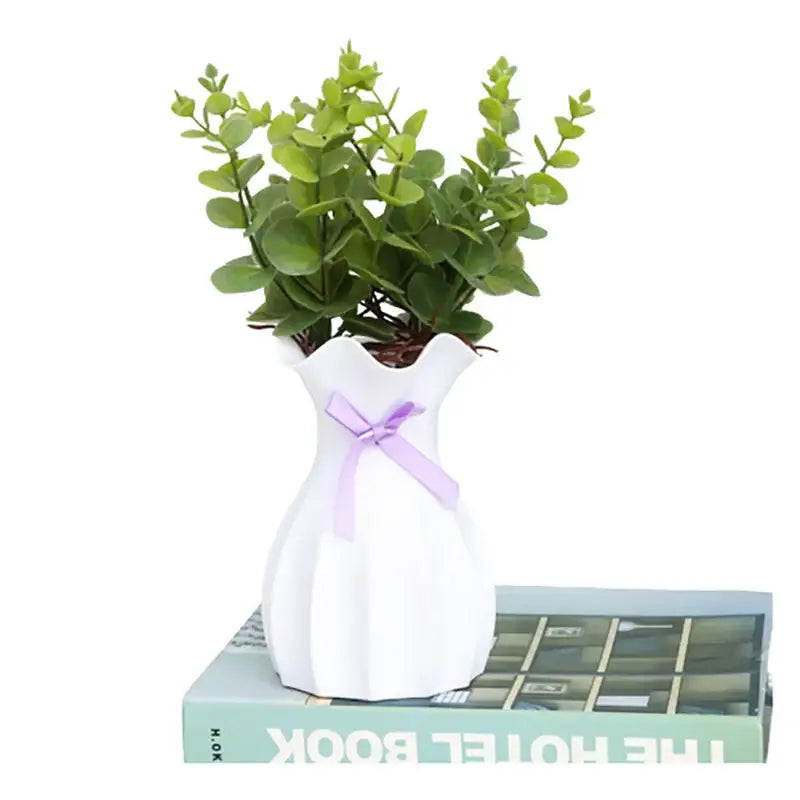 DecorBites™ modern nordic mini white ceramic flower vase home with fluted sides and lavender ribbon holding eucalyptus foliage