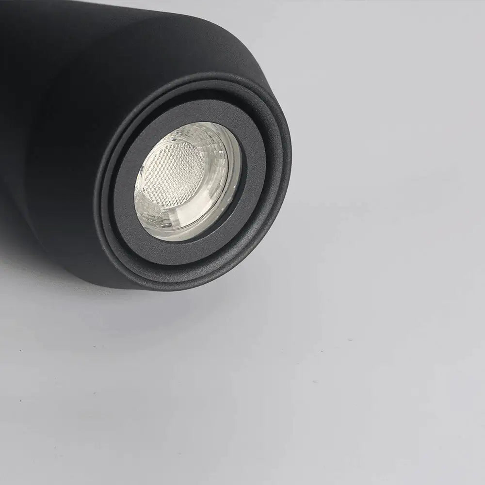 Black cylindrical led spotlight pendant light with matte finish and clear textured lens from DecorBites™ modern nordic hanging lights