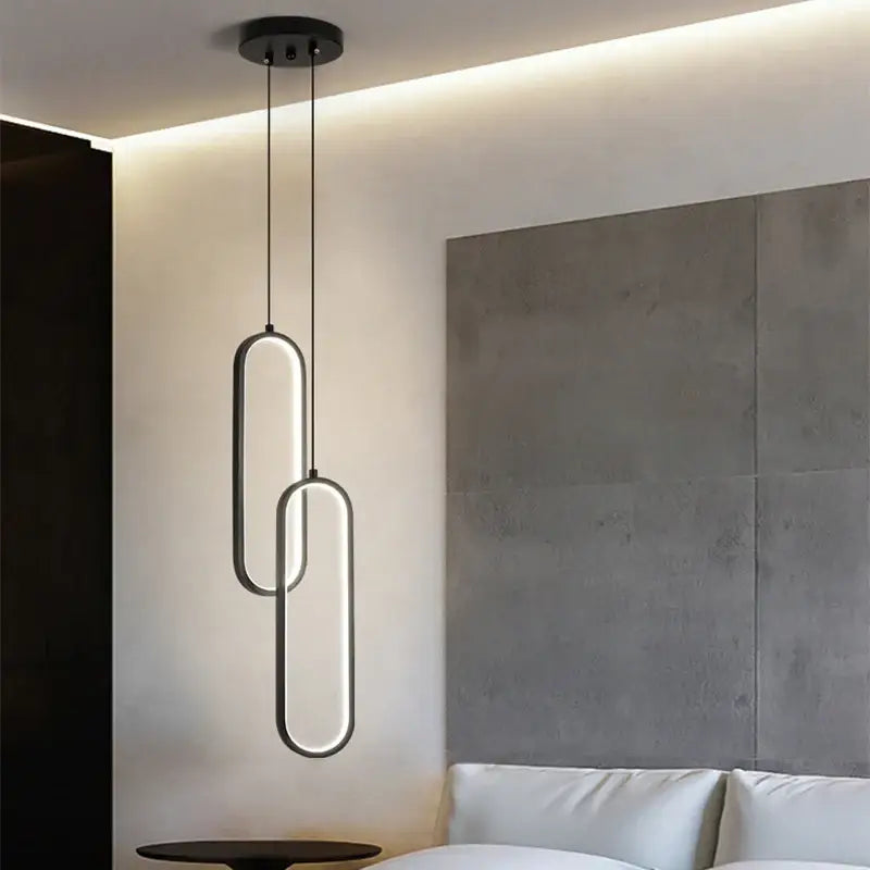 DecorBites™ modern nordic pendant light in black with sleek interlocking oval LED rings for home decoration