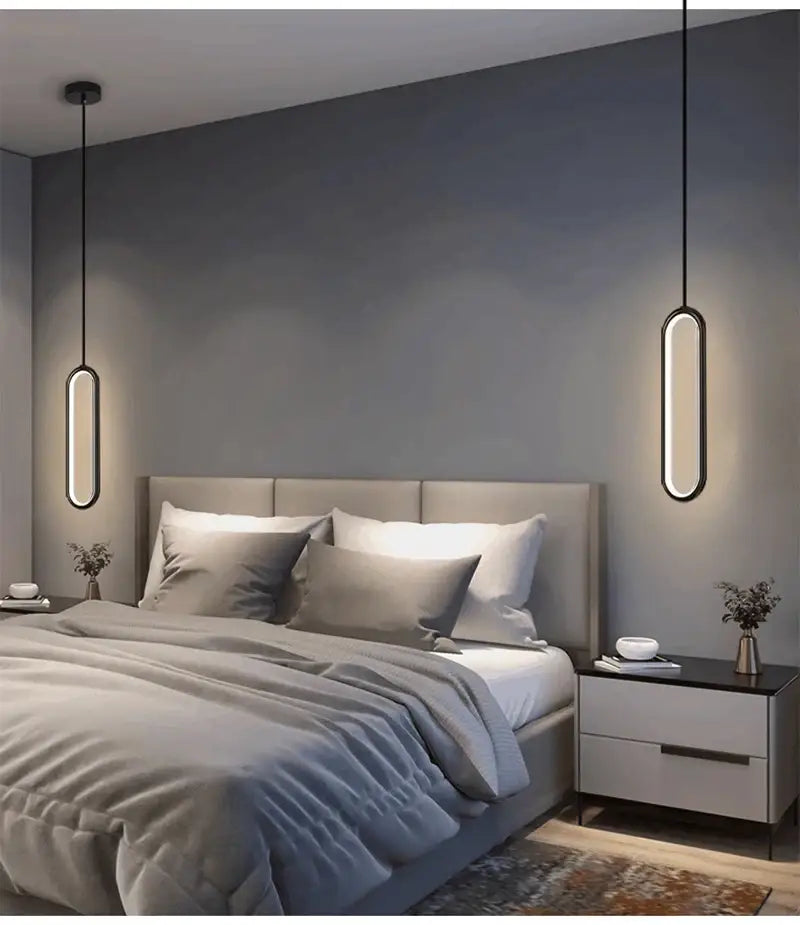 Decorbites™ modern nordic pendant light with sleek black frames and warm led illumination above the bed