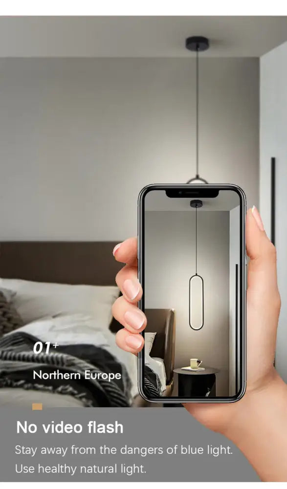 A sleek black decorbites modern nordic pendant light with minimalist oval design hanging from the ceiling