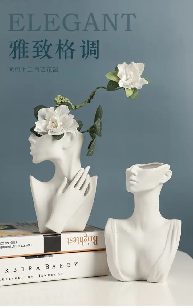 White ceramic nordic style ceramic body vase shaped like a woman bust with hand gently resting on cheek by DecorBites