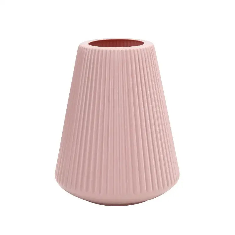 A sleek blush-pink ceramic DecorBites™ modern nordic vase with vertical ribbed texture for creative vase home decor