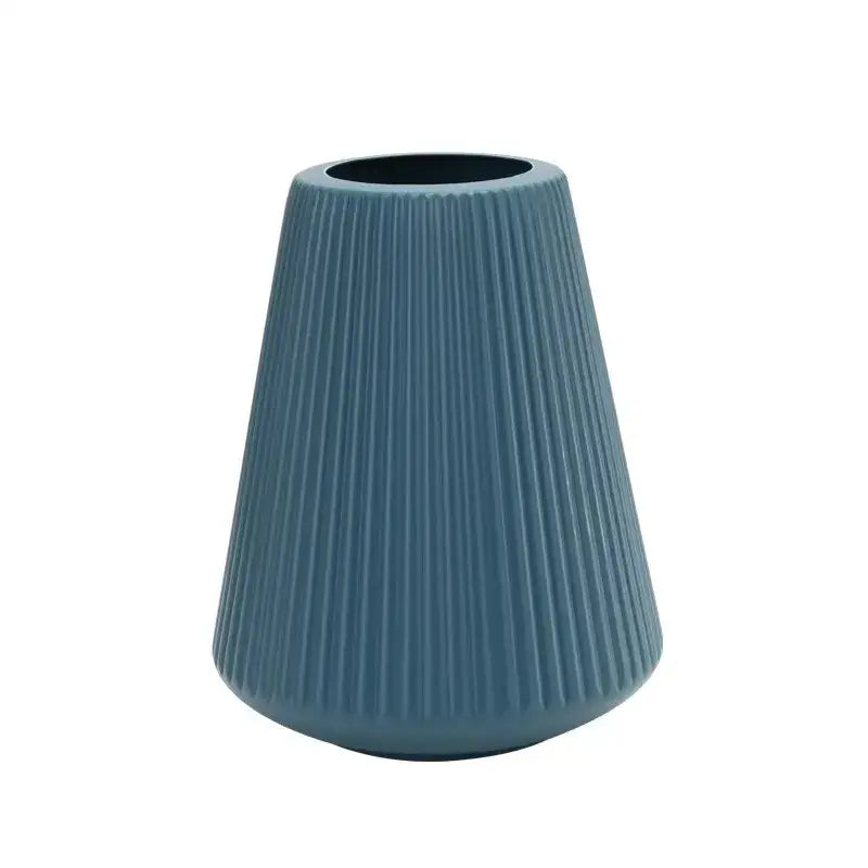 A sleek matte blue DecorBites™ modern nordic vase with vertical ribbed texture for creative vase home decor