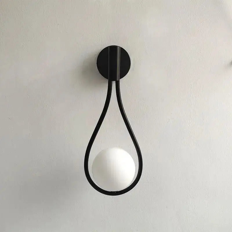 DecorBites™ modern Nordic black wall lamp featuring a minimalist teardrop frame with a frosted spherical bulb