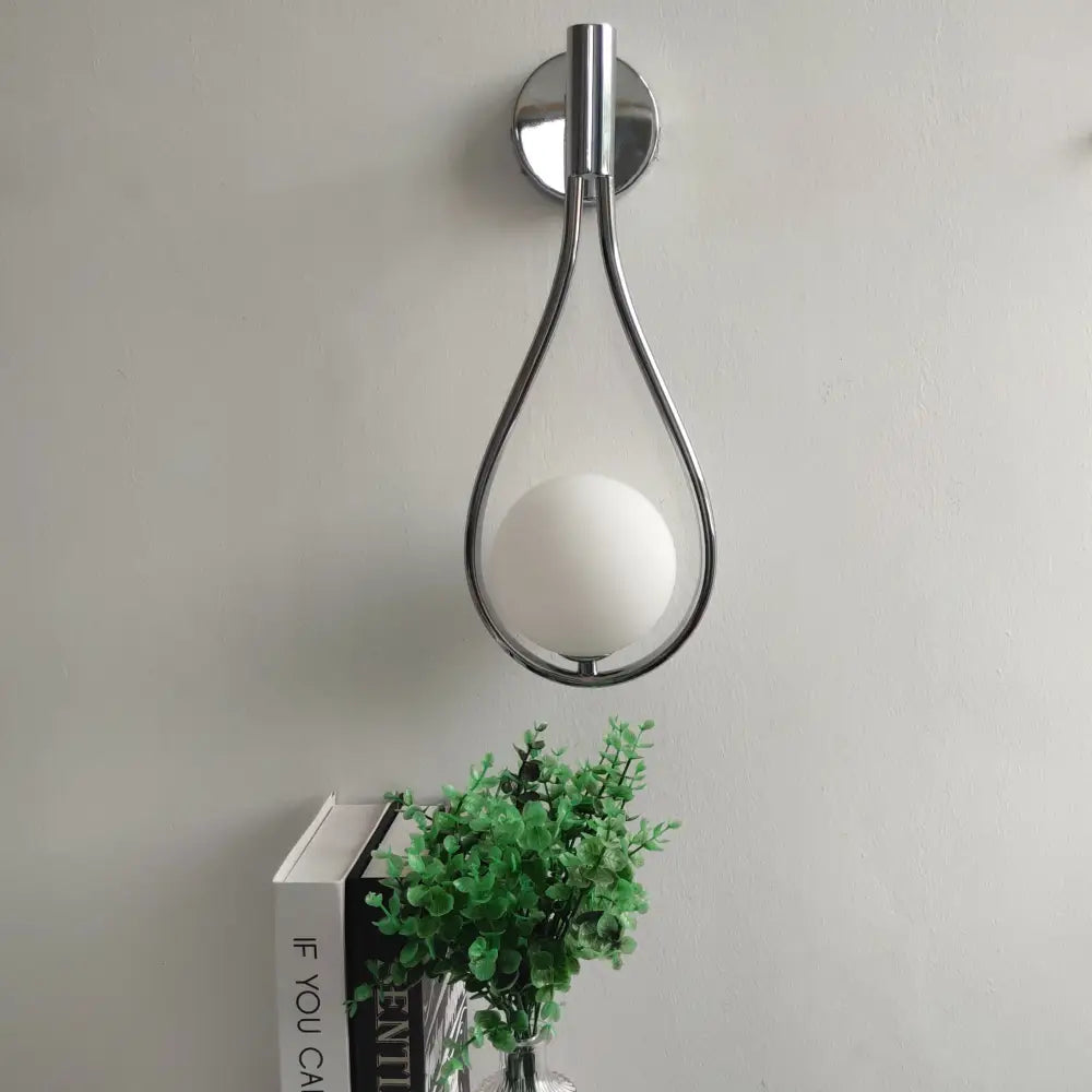 DecorBites™ modern nordic wall lamp with chrome finish teardrop frame and matte white spherical bulb, ideal livi wall lamp