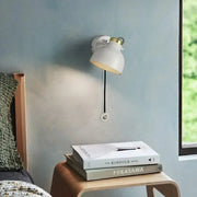 White wall sconce with brass accent and adjustable arm from DecorBites™ featuring modern nordic design for home decor