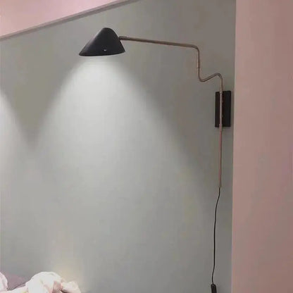 Black conical shade anneke wall sconce with articulated metallic arm and dark rectangular base from DecorBites modern nordic wall sconce