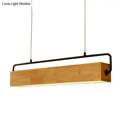 A modern nordic island pendant light with a natural wood body black metal frame and warm glow for 110v-120v 220v-240v use