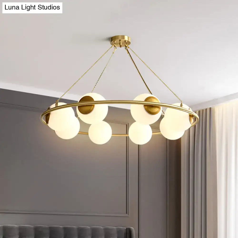 DecorBites modern opal glass ball chandelier with gold-toned circular frame and frosted glass spheres lighting fixture