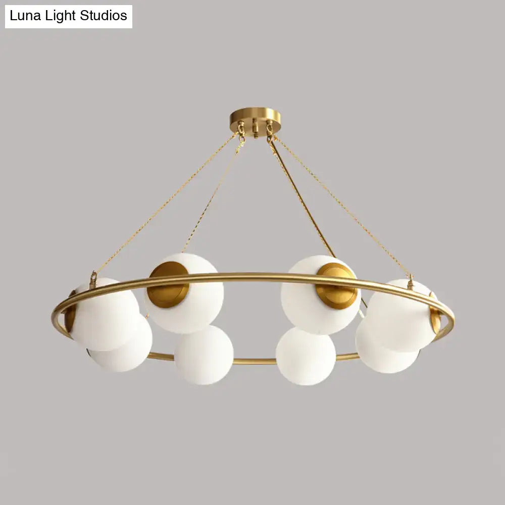 Decorbites modern opal glass ball chandelier with gold-toned circular frame and frosted glass spheres lighting fixture
