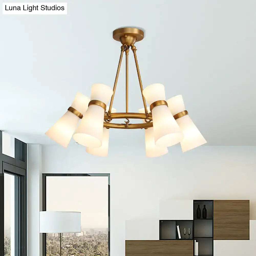 Brass-finished DecorBites modern wide flare pendant chandelier with eight frosted glass shades in circular pattern