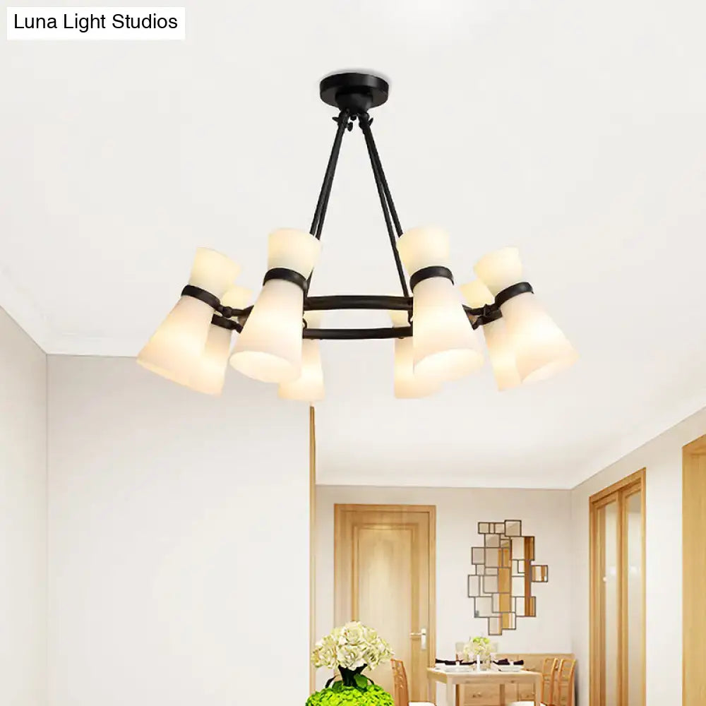 Black metal wide flare pendant chandelier with 16 frosted opal glass shades in black and gold finish