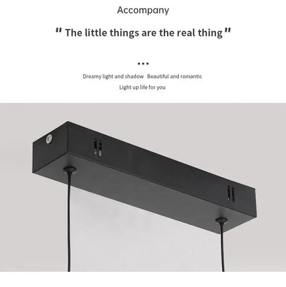 Black rectangular pendant light fixture with matte finish and minimalist design for dining room pendant lights by DecorBites