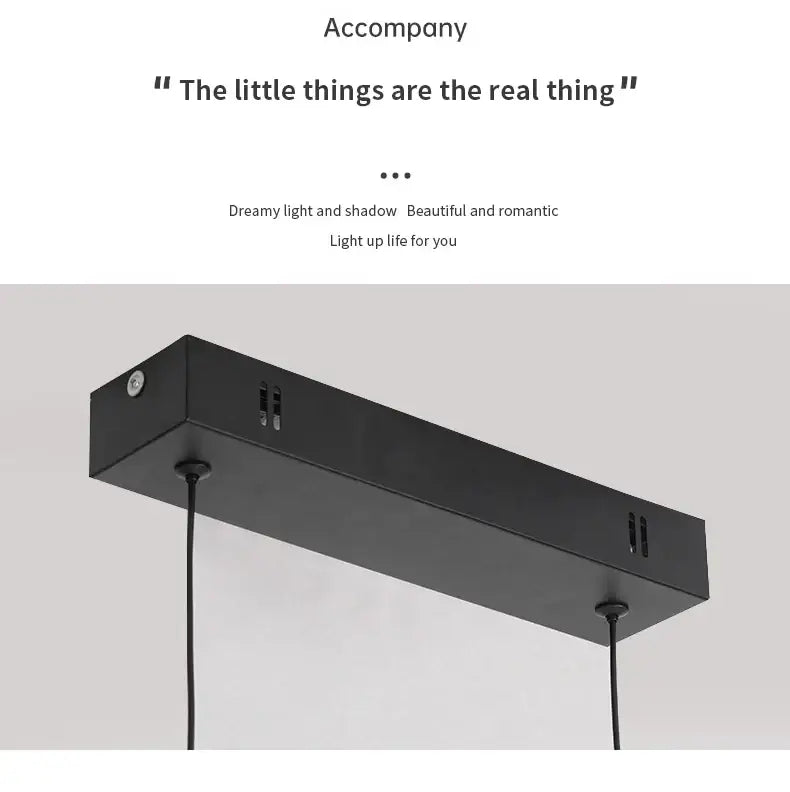 Black rectangular pendant light fixture with matte finish and minimalist design for dining room pendant lights by DecorBites