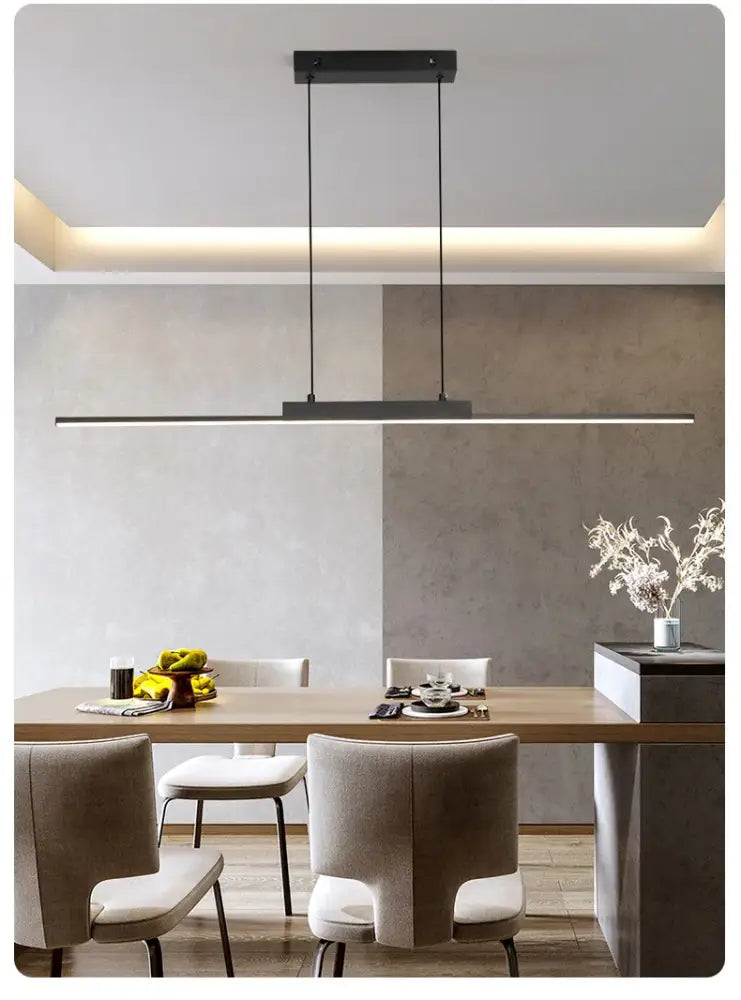 Modern black rectangular pendant light with sleek minimalist design hanging above dining table for dining room use