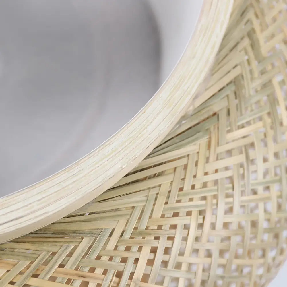 A light beige woven bamboo hat with curved brim and herringbone pattern featured in DecorBites™ rattan pendant light ceiling fan