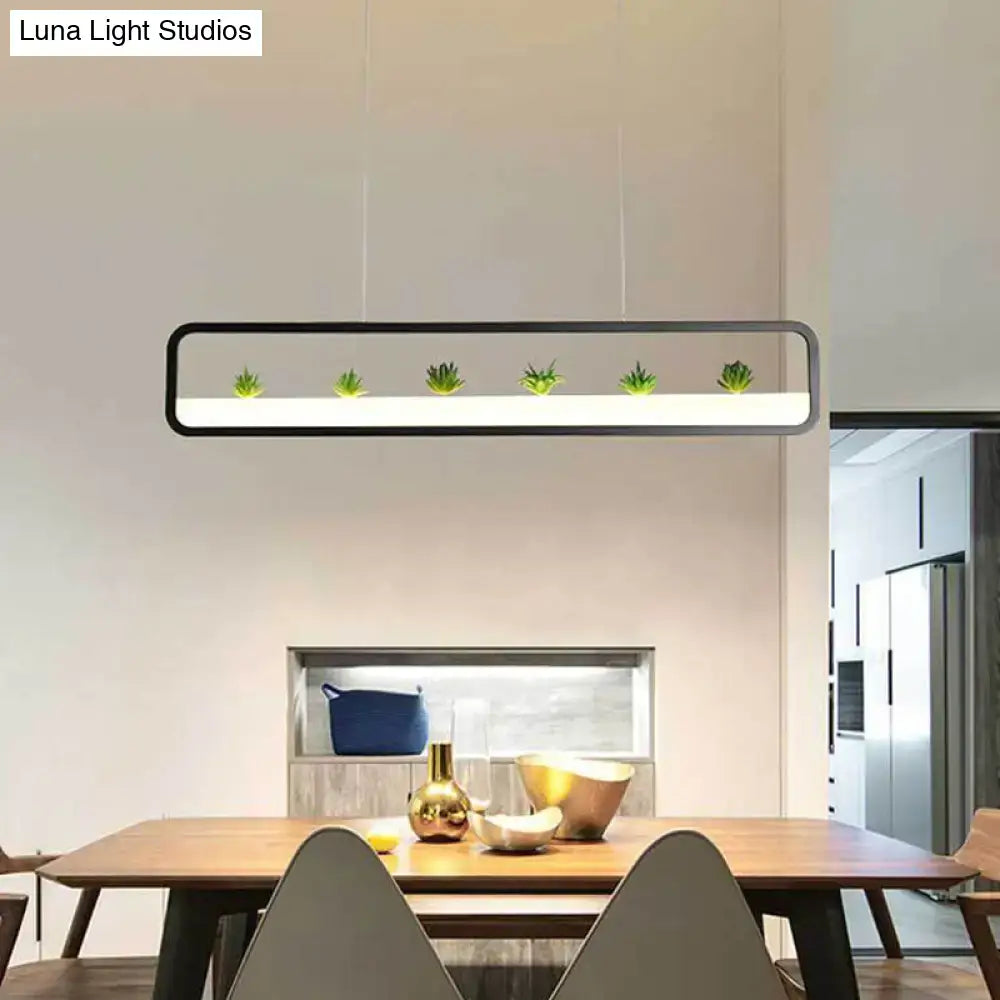 Modern rectangular black white acrylic dining room ceiling light with integrated LED and succulents by DecorBites