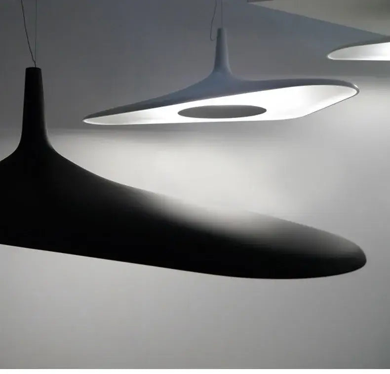 Black and white modern resin pendant lamp with sleek organic shapes for dining room changeable light by decorbites