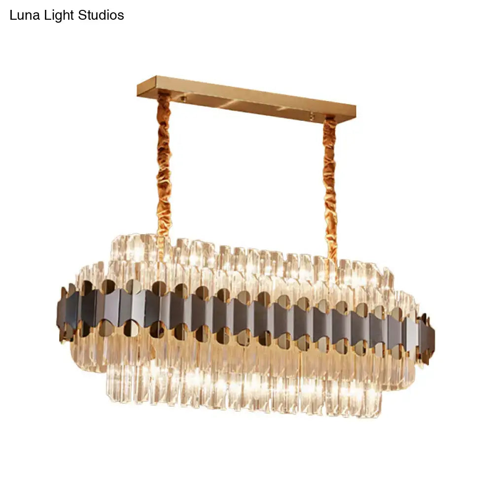 Gold-toned and black modern chandelier with cascading crystal prisms in oval shape for 220v-240v and 110v-120v use