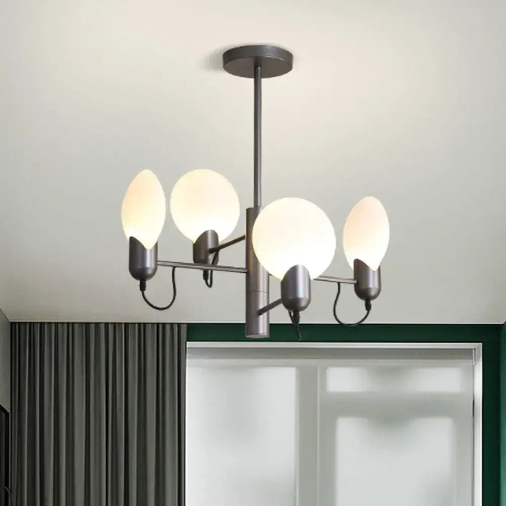 Modern matte black metal chandelier with four frosted opal glass globes complements silver gray ceiling light decor