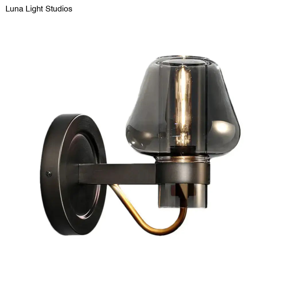 Dark bronze lighting fixture featuring a modern smoked glass mushroom shade with brass accent for bedroom use