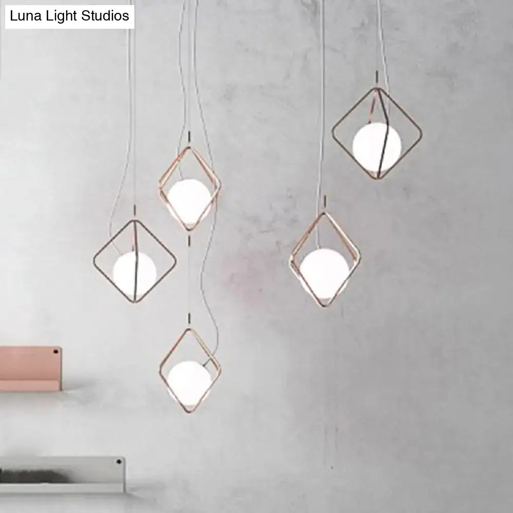 Modern geometric square suspension light with rose gold metal frame and white glass orb shade for living room decor