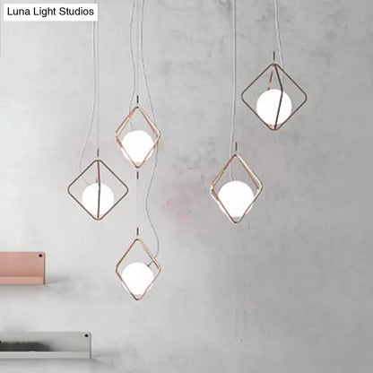 Modern geometric square suspension light with rose gold metal frame and white glass orb shade for living room decor