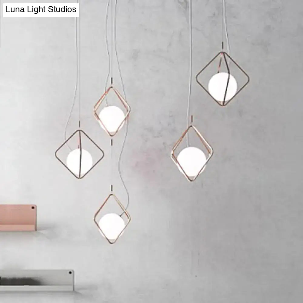 Modern geometric decorbites™ square suspension light with rose gold metal frame and white glass orb shades for living room